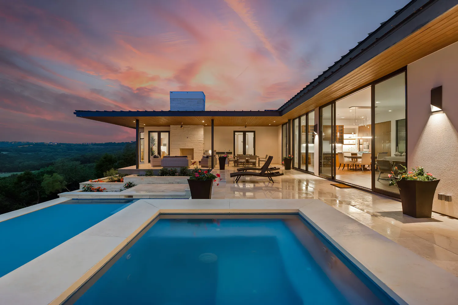 Rivendale Homes pool and outdoor living area overlooking the hills at sunset